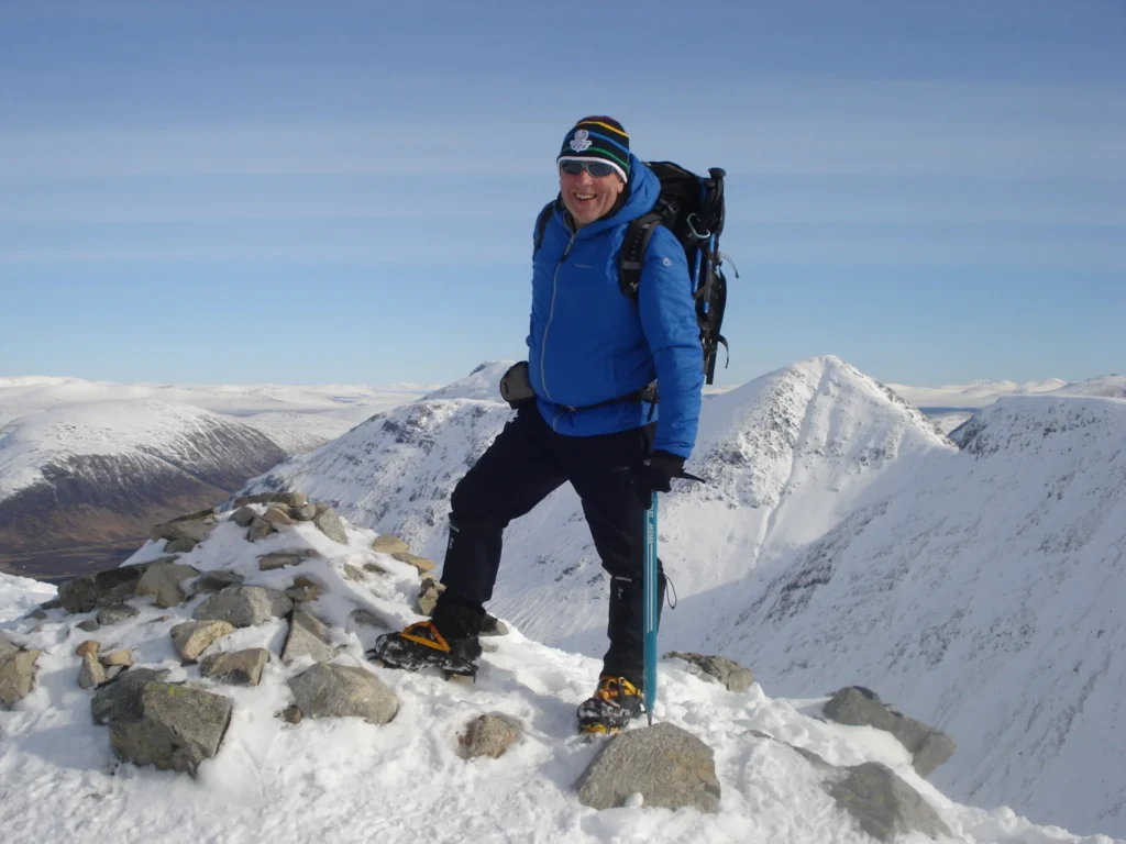 standing on top of a mountain