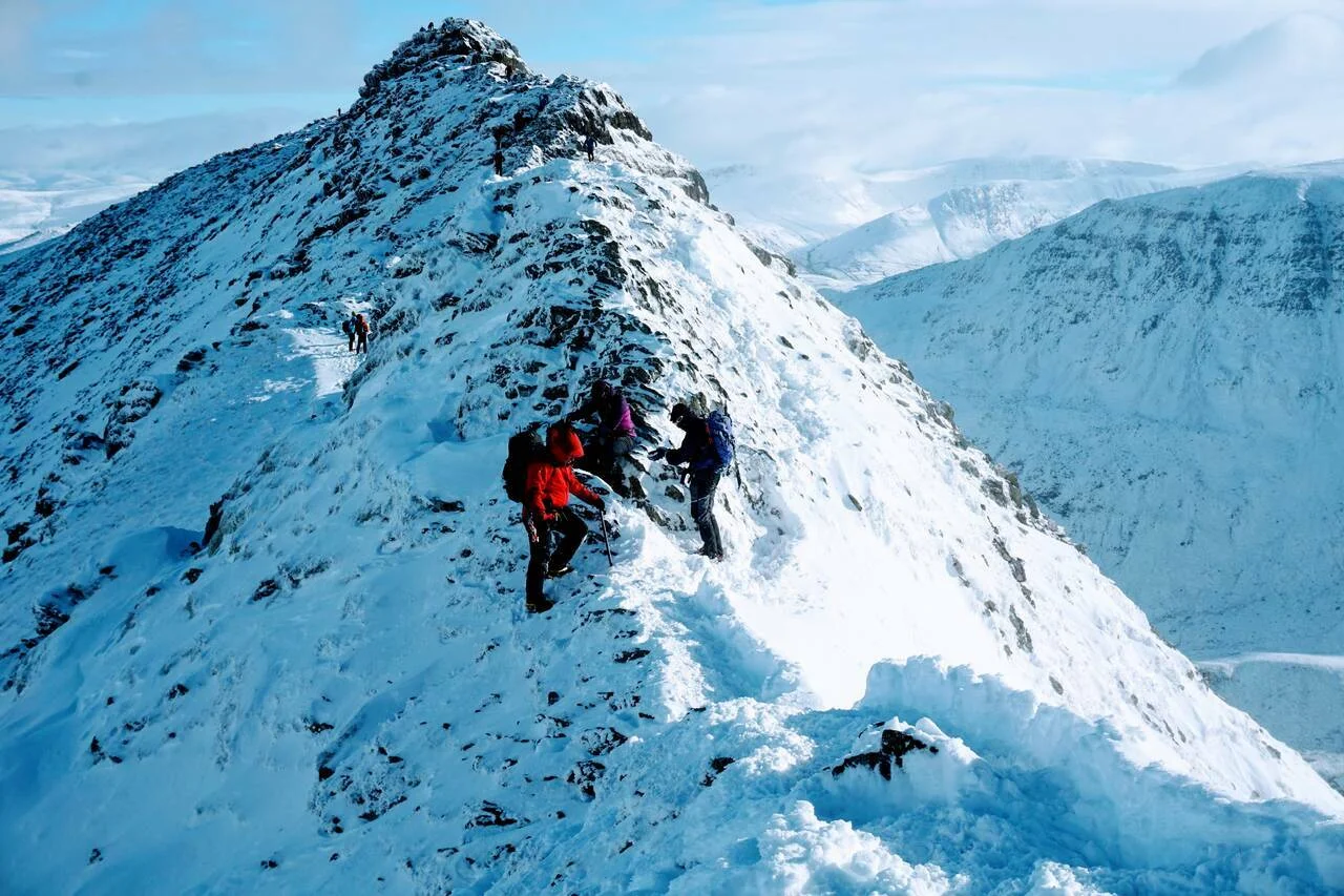 Winter mountain skills course in snowy Cairngorms terrain
