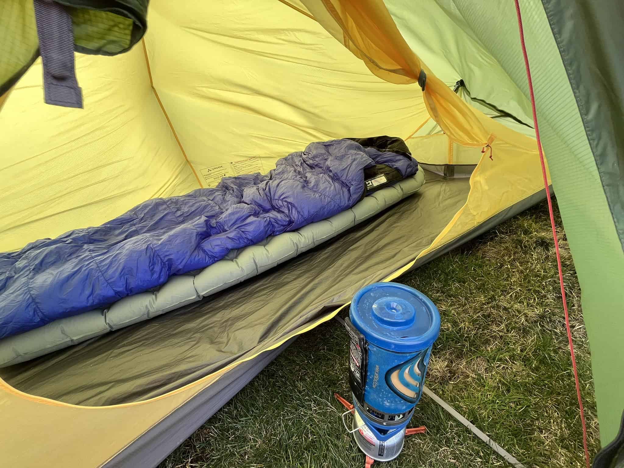 Sleeping bag and insulated sleeping mat inside a backpacking tent