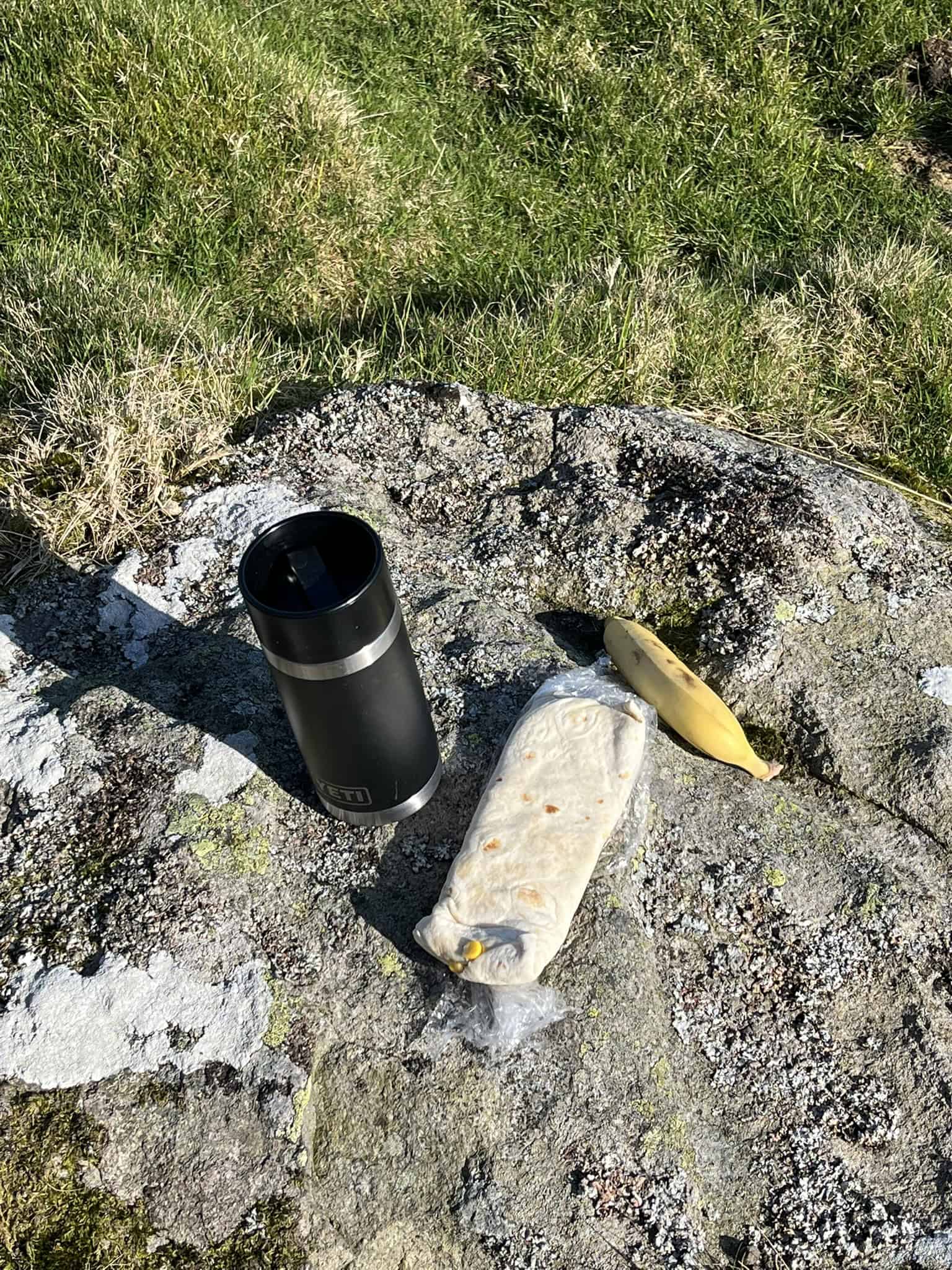 Mountain backpacking equipment system laid out for a wild camping trip