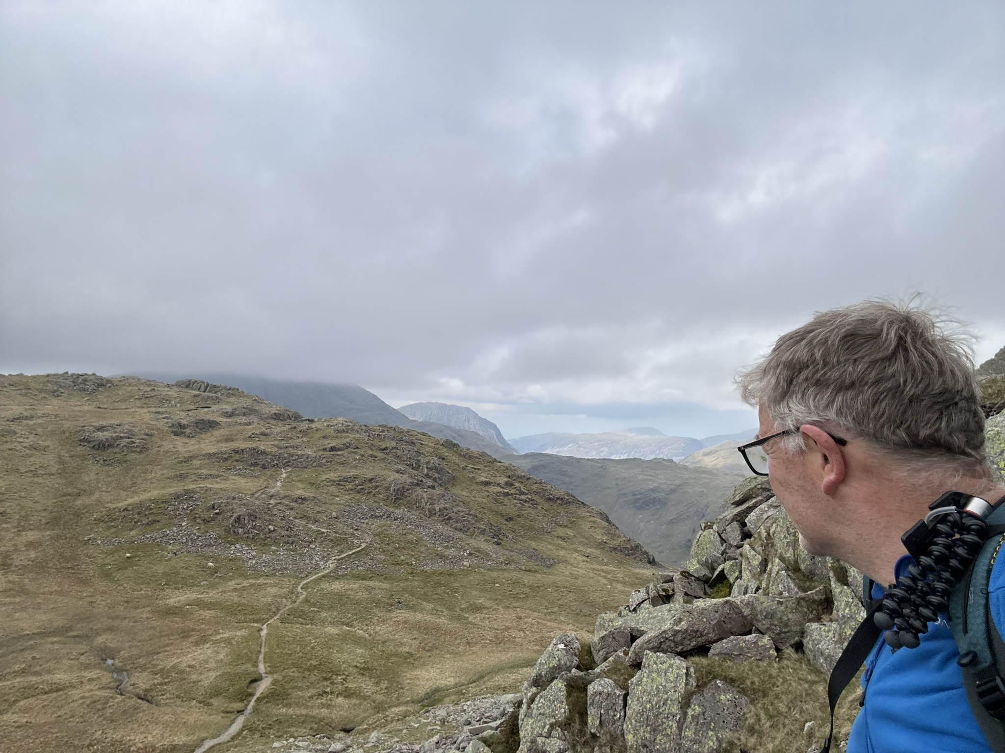 Mountain guide overlooking the Lake District during a small group wild camping journey