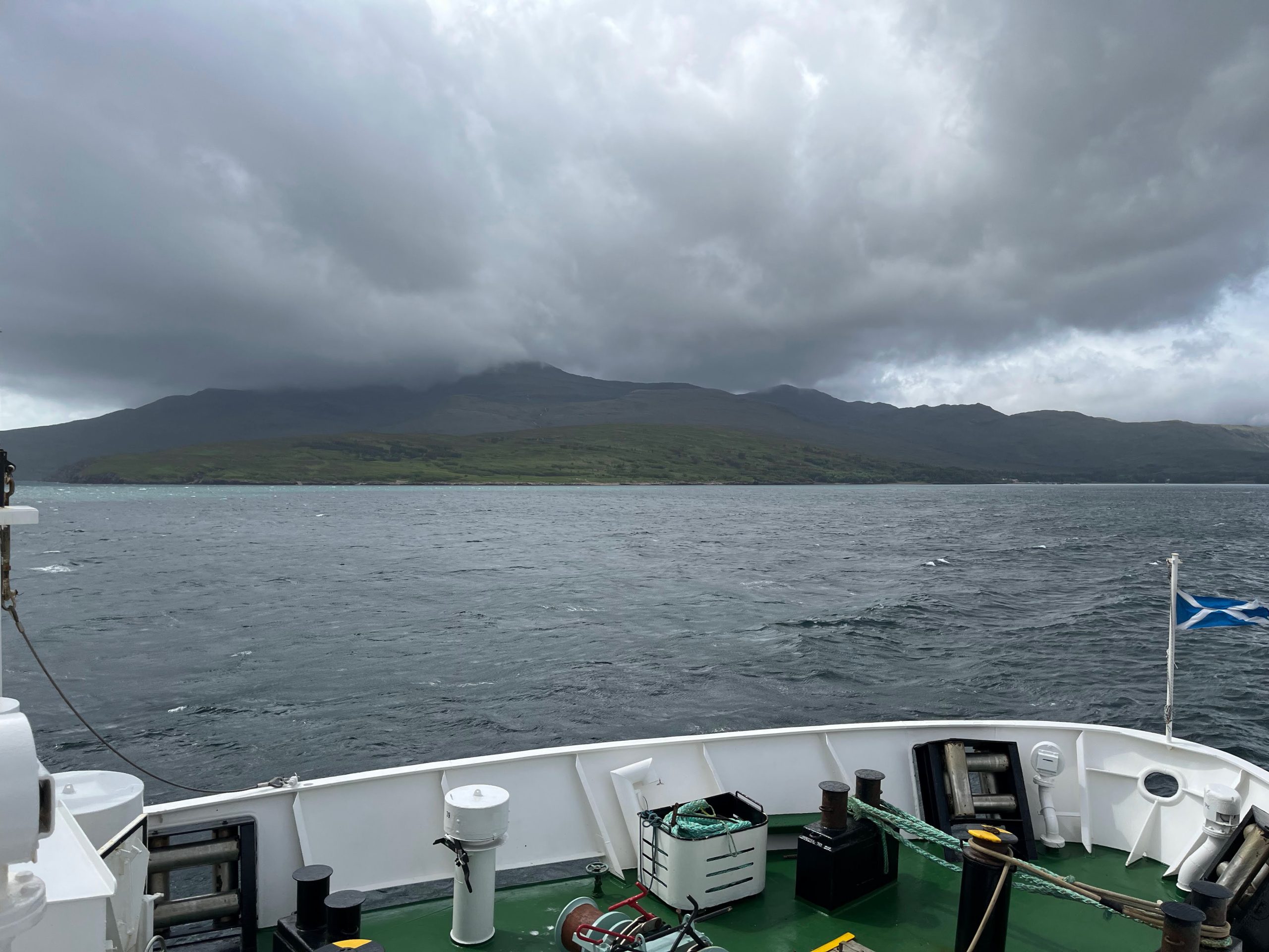 Isle of Rum ferry approach with dramatic mountain backdrop