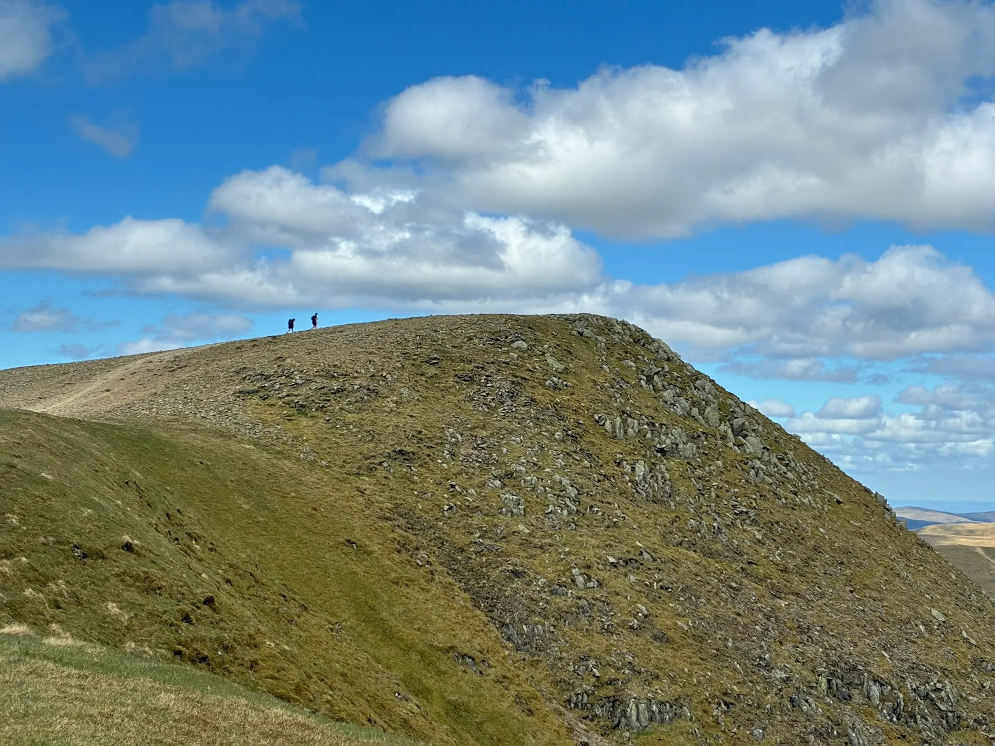 Walkers approaching Helvellyn on a guided mountain walk
