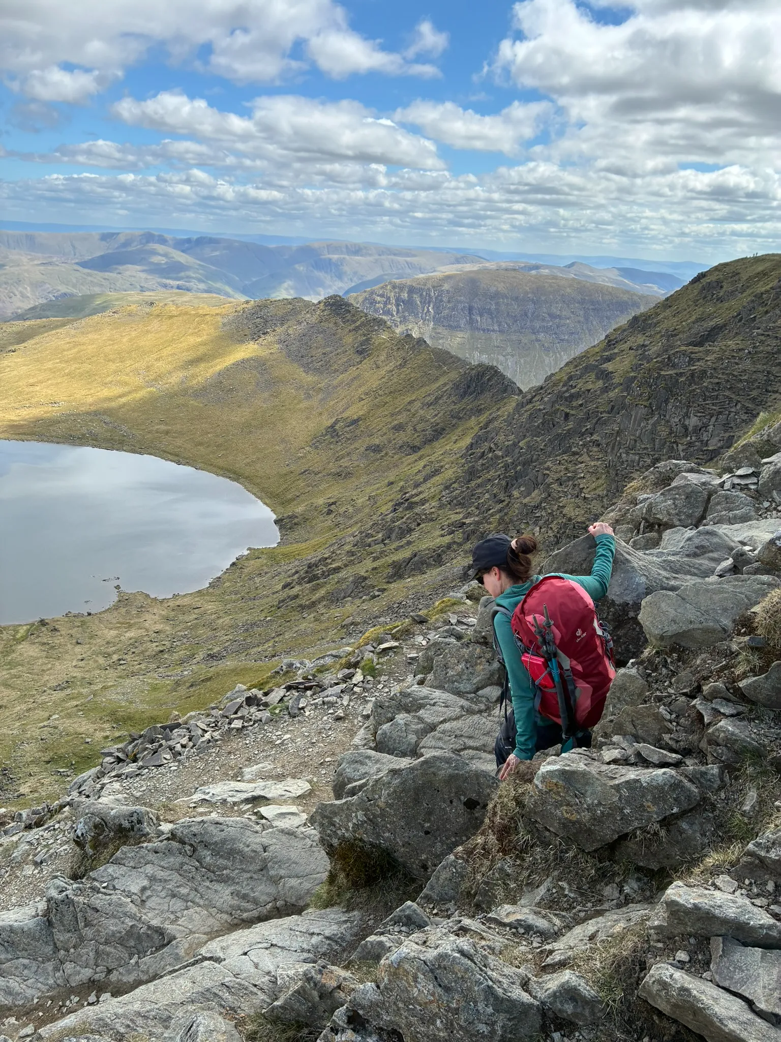 Guided walker on Helvellyn rocky terrain